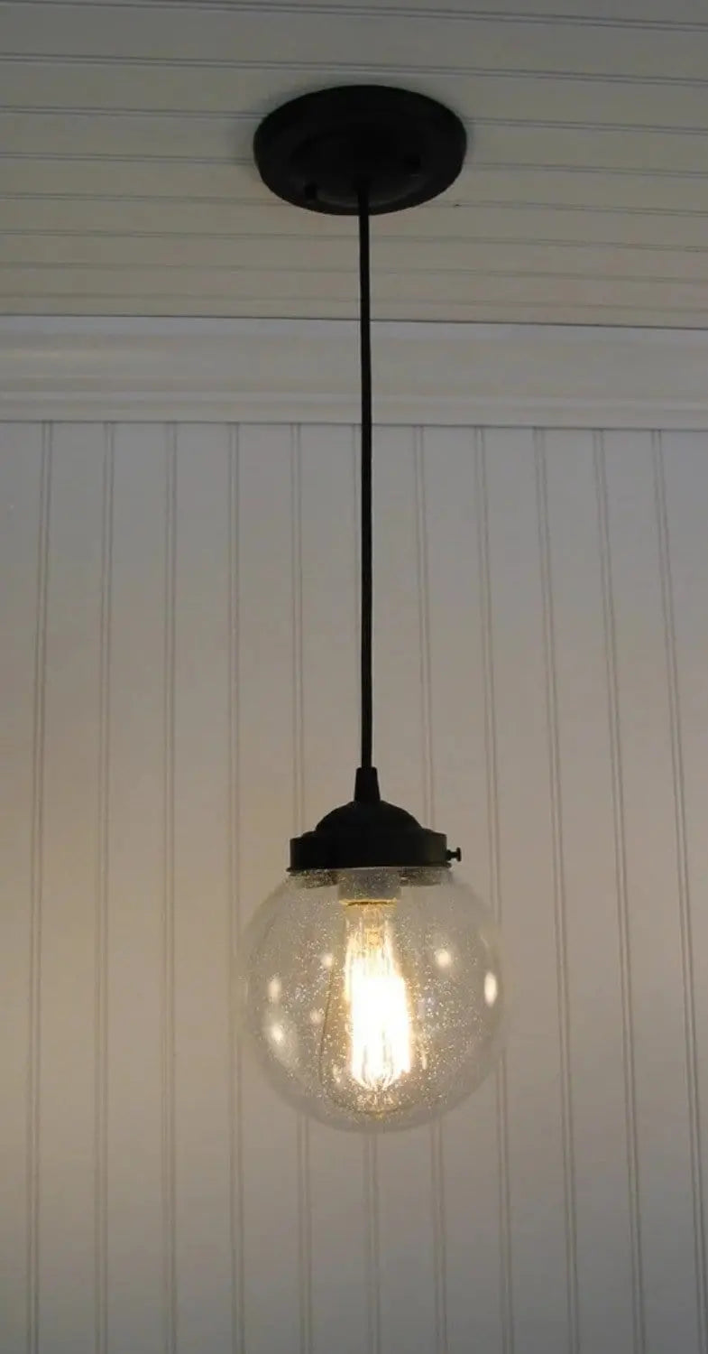 Single seeded glass pendant light