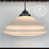 Cream milk glass pendant light with black metal fixture; double-layered shade.
