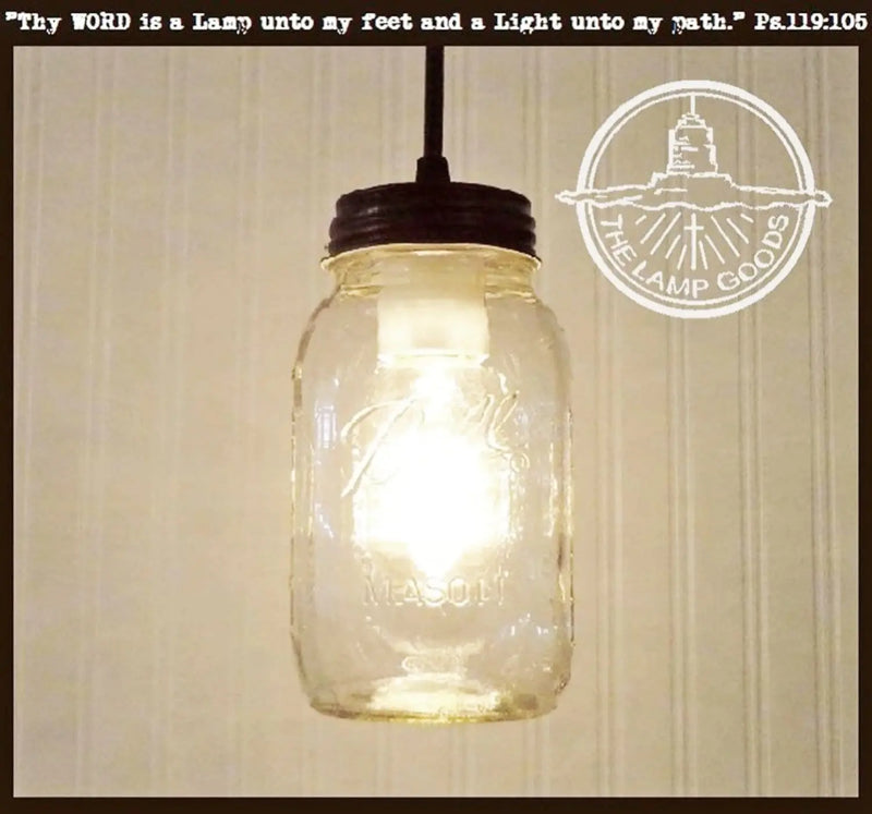 Mason jar quart pendant light with dark bronze top, perfect for rustic farmhouse decor.
