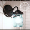 Blue mason jar light fixture sconce with dark bronze metal arm; The Lamp Goods.
