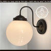 Large Milk Glass Globe Wall Sconce with black metal arm; The Lamp Goods
