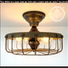 Rustic industrial cage ceiling light fixture with four Edison bulbs; The Lamp Goods.
