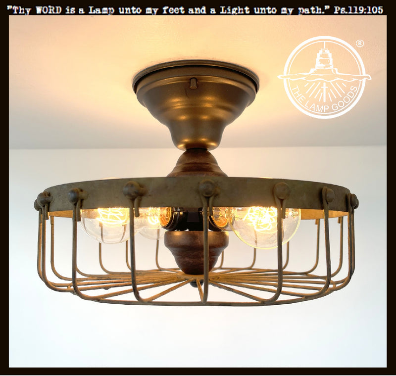 Rustic industrial cage ceiling light fixture with four Edison bulbs; The Lamp Goods.
