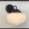 Modern Milk Glass Sconce Wall Light: Black metal sconce with a creamy white glass shade.
