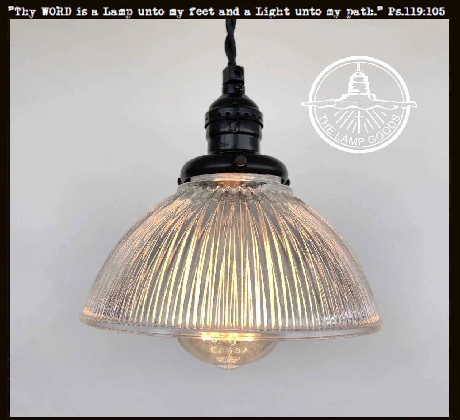 Antique glass Holophane pendant light with ribbed shade, black metal fitting, from The Lamp Goods.
