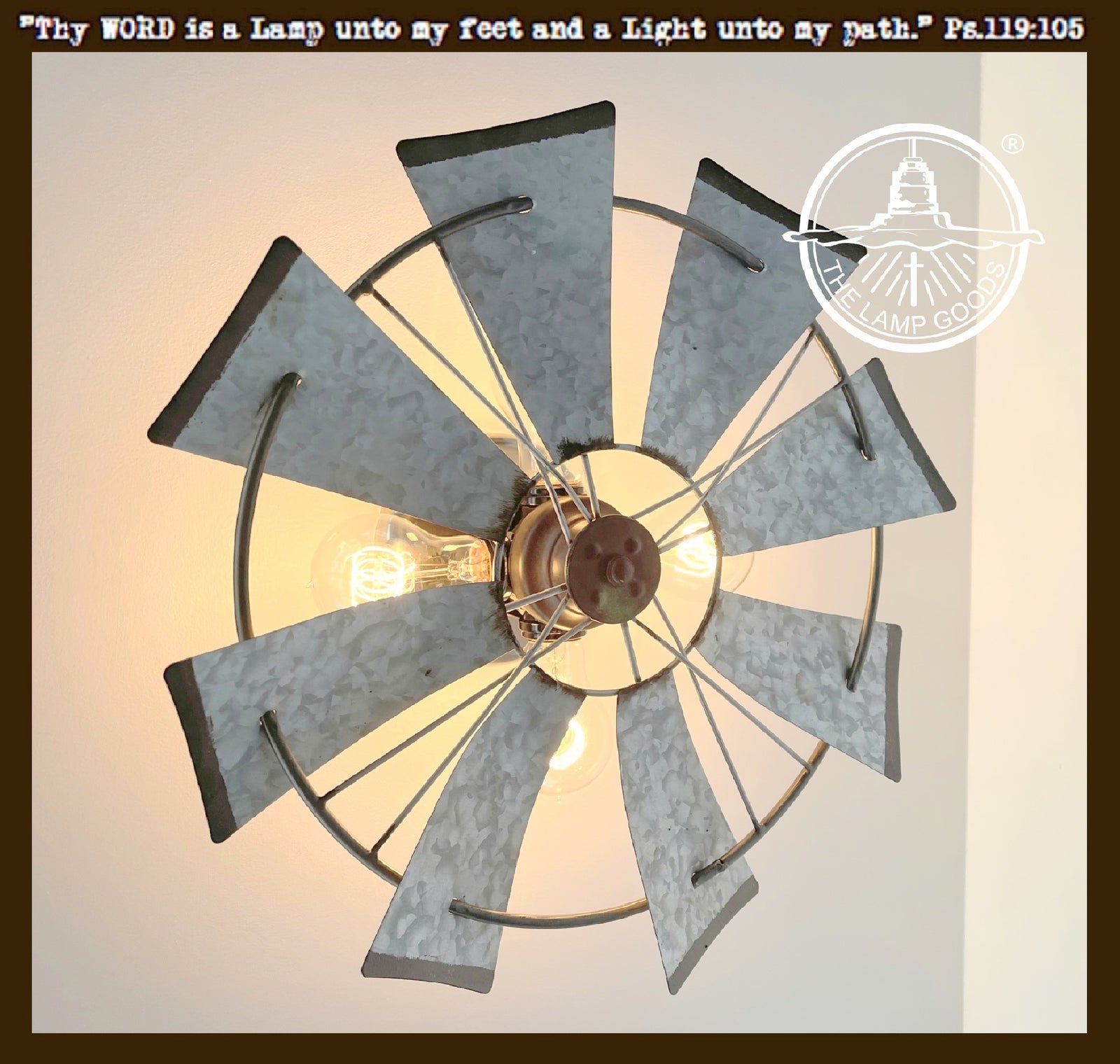 Galvanized windmill farmhouse wall sconce; three-light fixture with distressed metal finish.
